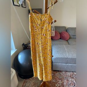 Yellow floral spring dress with small slit at bottom